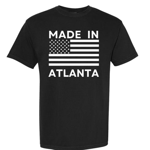 Black t-shirt with 'Made in Atlanta' text and American flag design on a white background