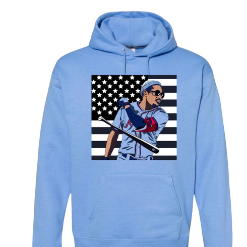 Light blue hoodie with a graphic of a baseball player and American flag on a white background