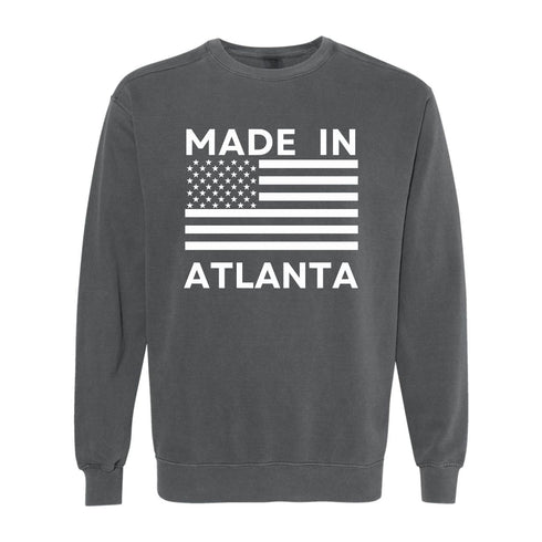 Gray sweatshirt with 'Made in Atlanta' text and American flag design on a white background