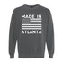Gray sweatshirt with 'Made in Atlanta' text and American flag design on a white background
