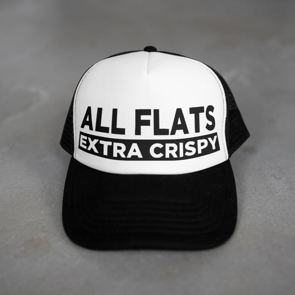 Black and white cap with 'ALL FLATS EXTRA CRISPY' text on a gray background