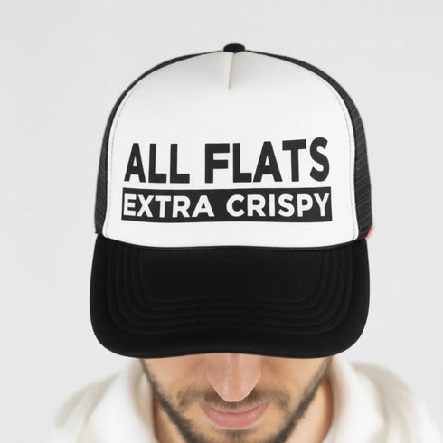 Model wearing the white and black All Flats Extra Crispy Trucker Hat, inspired by Atlanta wing culture, with adjustable fit.