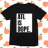 Black t-shirt with 'ATL IS DOPE.' text on a patterned background
