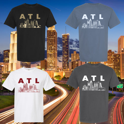 ATL Skyline T-shirts in blue jean, white, pepper, and black, each with a bold Atlanta skyline graphic.