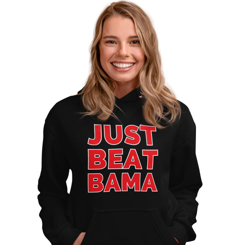 Girl wearing a black hoodie with JUST BEAT BAMA graphic on the front