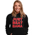 Girl wearing a black hoodie with JUST BEAT BAMA graphic on the front