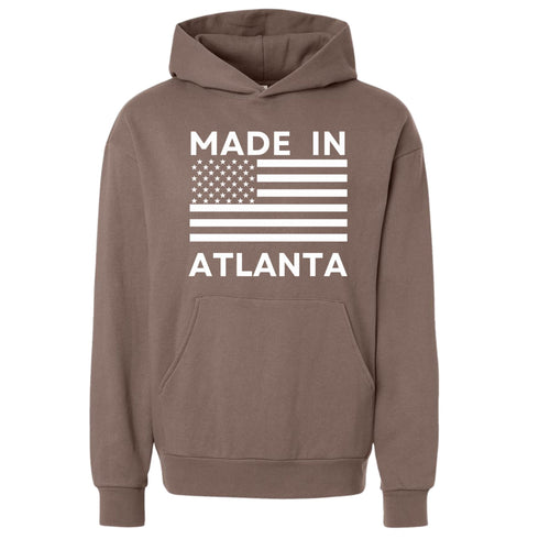 Brown hoodie with 'Made in Atlanta' text and American flag design on a white background