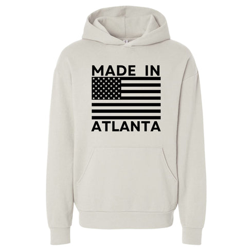 Beige hoodie with 'Made in Atlanta' text and American flag design on a white background