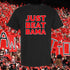 Black t-shirt with 'JUST BEAT BAMA' text in red, set against a background of people holding signs.