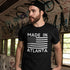 Man wearing a black Made in Atlanta t-shirt with a bold graphic American flag.