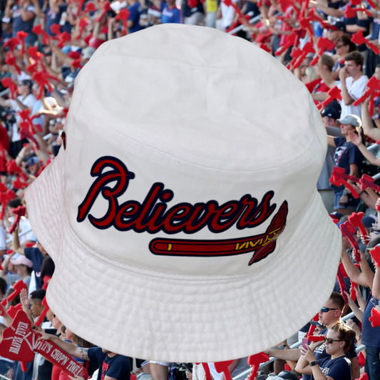 White bucket hat with 'Believers' text in a sports setting